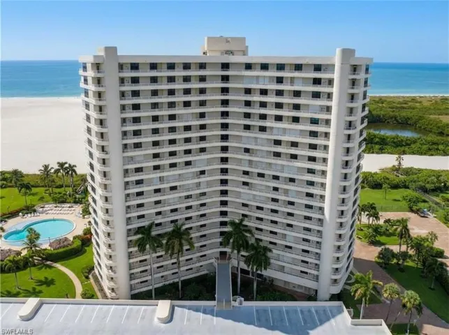 View of property featuring view of water and beach