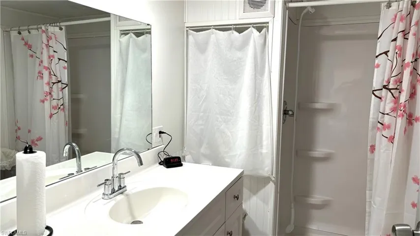 The Bathroom features a full-size shower.