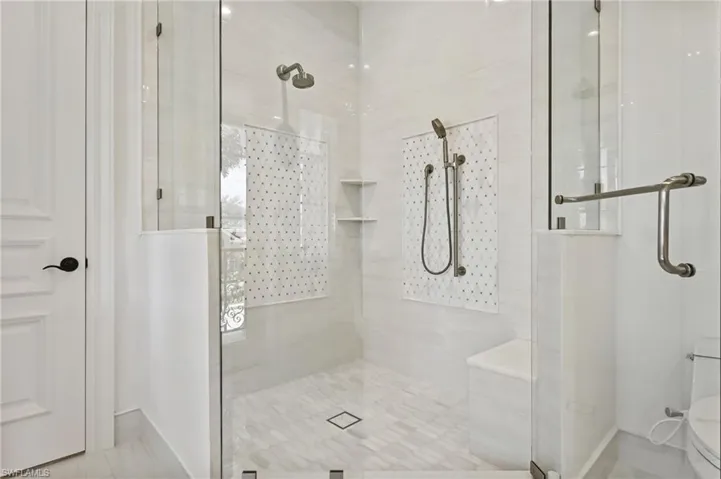 Full bathroom with a stall shower and tile patterned floors