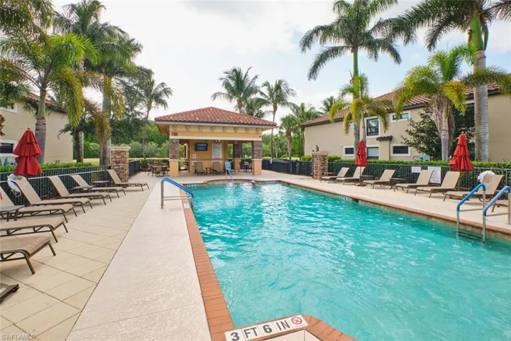 Community pool with a patio area