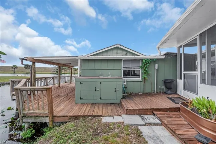 Deck with fish cleaning station and fishing pier