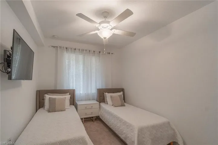 Bedroom with carpet and ceiling fan