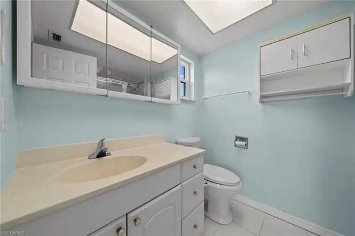 Bathroom with vanity and tile patterned floors