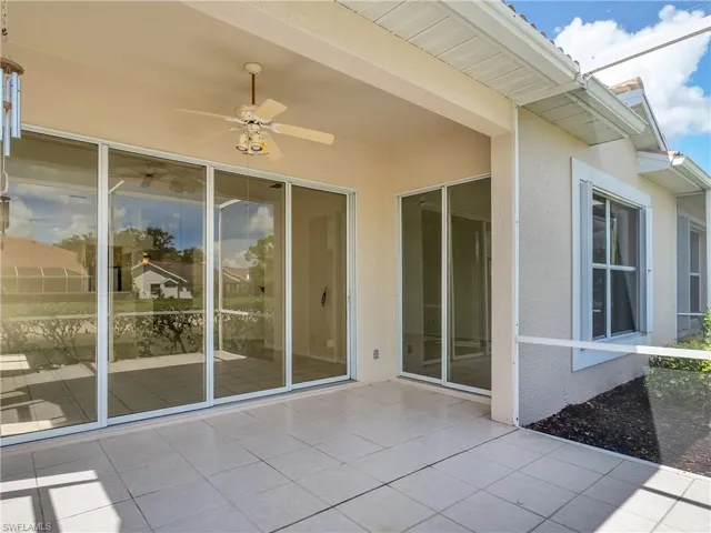 View of the Enclosed lanai with convenient entrance to the Living Room and Primary Bedroom