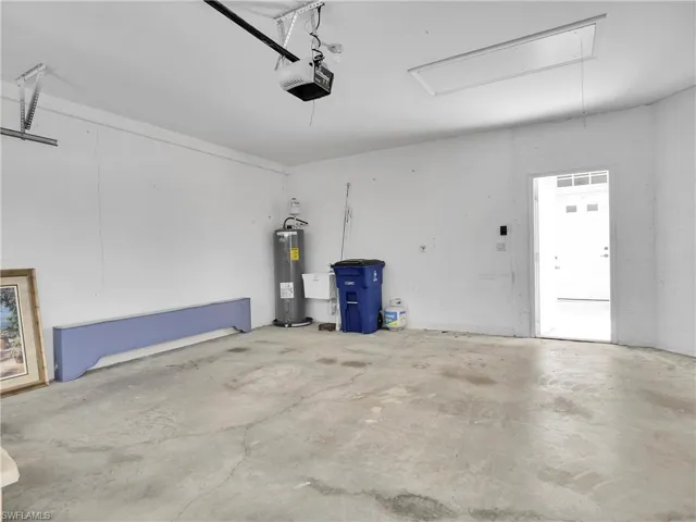 Garage has a utility tub and water heater