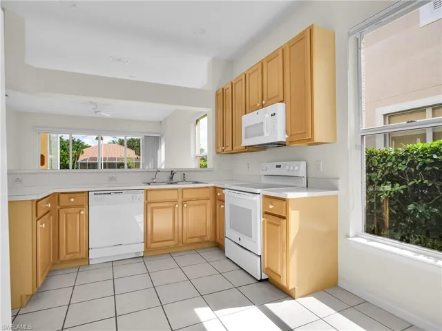 Light and Airy, Eat-in Kitchen featuring white appliances, light countertops.