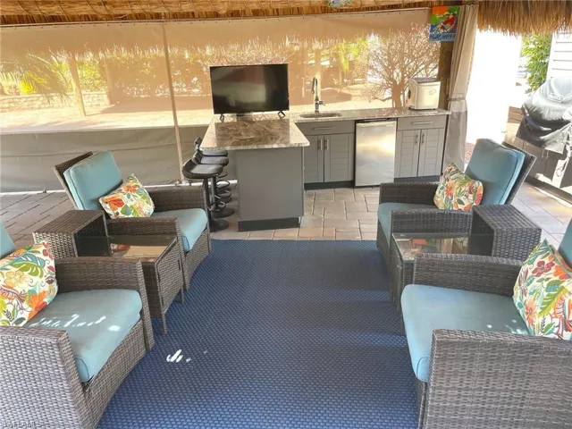 View of patio / terrace featuring an outdoor hangout area, a sink, and area for grilling
