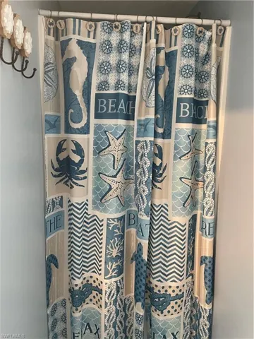 Bathroom with a shower with curtain