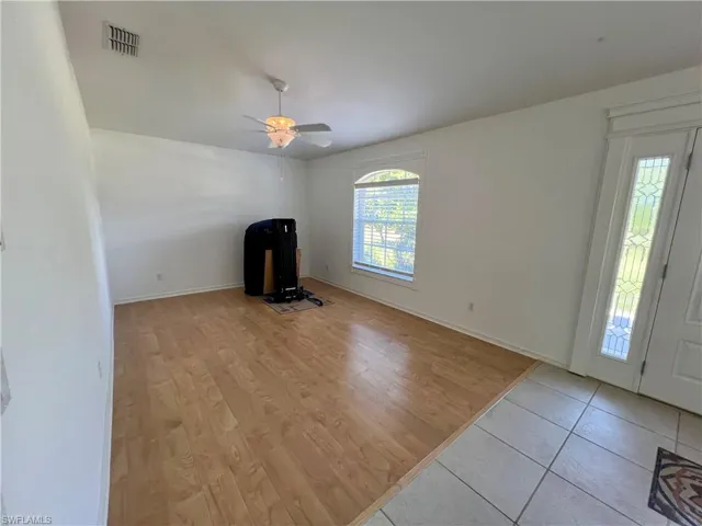 Unfurnished living room/Den  with ceiling fan and light hardwood / wood-style floors