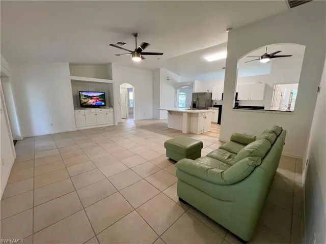 Tiled living room with ceiling fan