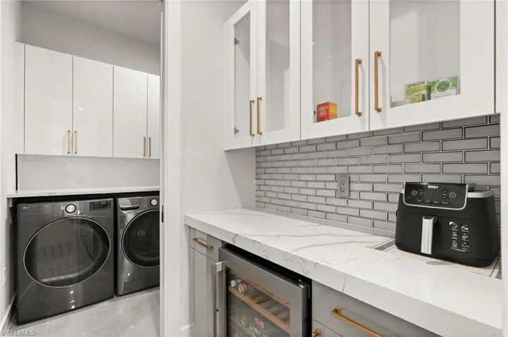 Bar area with separate beverage refrigerator.