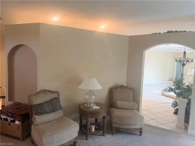 Living area featuring recessed lighting, archways, and tile flooring in the adjacent space