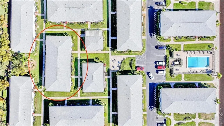 Aerial view of residential area featuring a pool