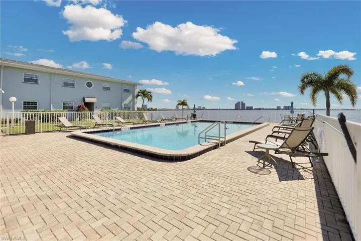 Community pool featuring a patio area