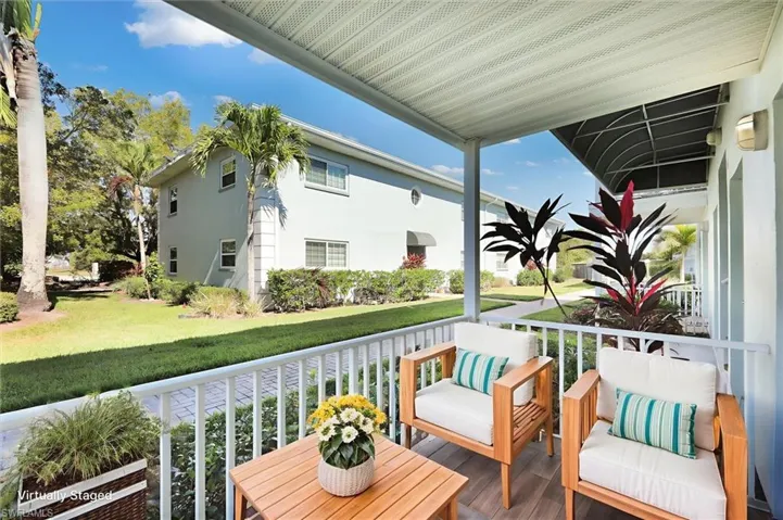 Virtually staged Balcony porch featuring a sunroom
