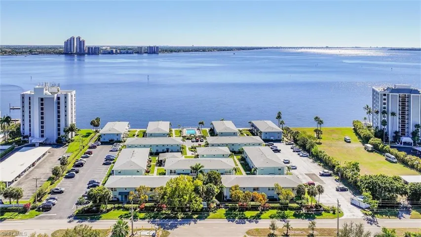 Bird's eye view of a large body of water and apartment complex