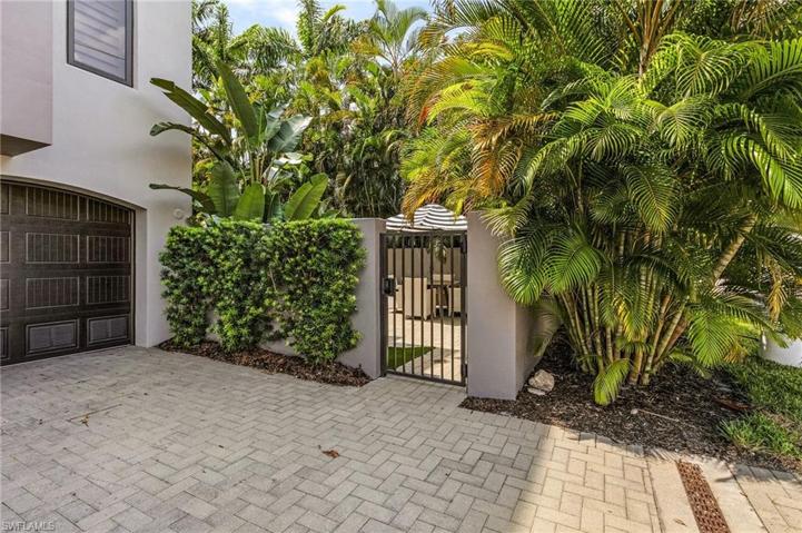 Alley access to two car garage and gate to private courtyard