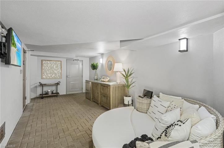 Covered outdoor living area w/ beverage coolers & TV