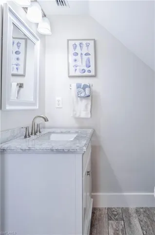Bathroom with lofted ceiling