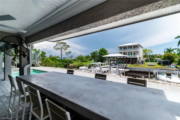 View of patio / terrace featuring an outdoor pool and a ceiling fan