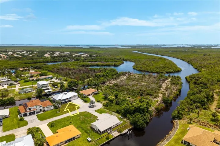 Aerial view of residential area with a large body of water