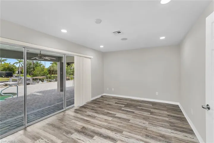 Empty room with wood finished floors, recessed lighting, and ceiling fan