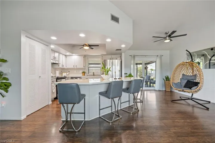 Open kitchen layout with Impact Resistant Pocket Sliding Glass Door for seamless indoor-outdoor living.