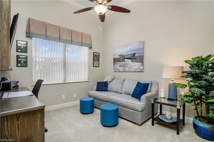 Office featuring ceiling fan and light colored carpet