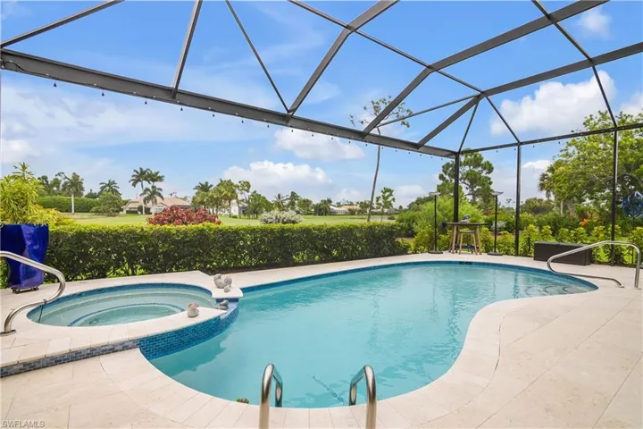 View of pool featuring an in ground hot tub and a lanai