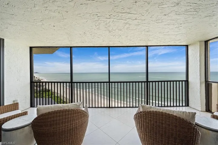 Balcony off the family room and primary bedroom looks SW down Vanderbilt Beach