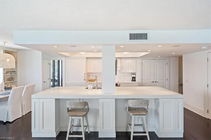 Breakfast bar has extra seating and storage under the countertops