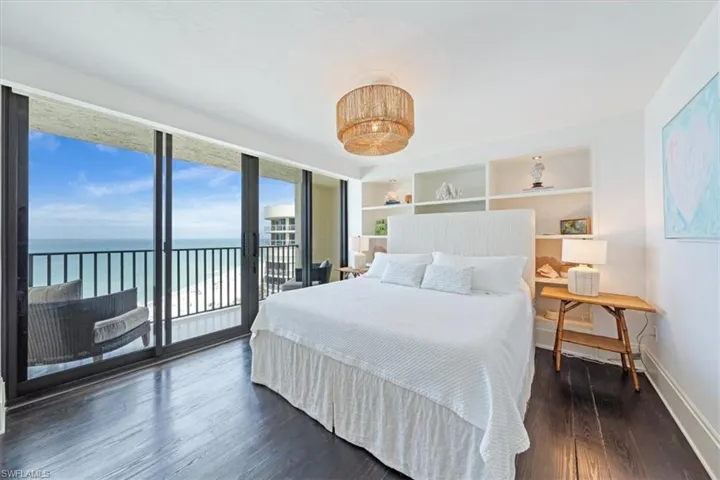 Guest Bedroom #1 has a king bed, its own balcony and built in shelves