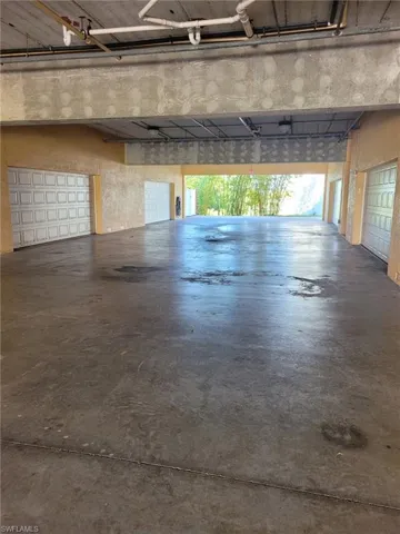 2 lane breezeway drive under building for entrance to garage