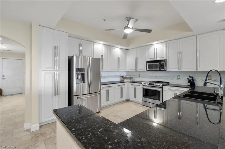 As you enter the front door you are greeted by a warmly lit hall that opens to a bedroom on the left and a bedroom, linen closet and bathroom to the right - before you even step into the kitchen.
