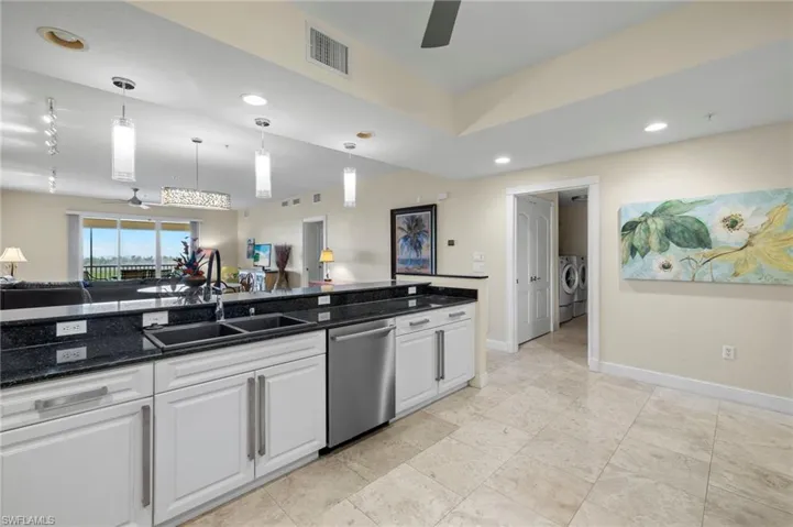 Open kitchen, dining, living room all with view of Bay
