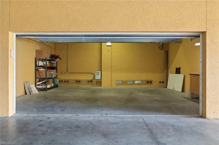 Private oversized 2 car garage with automatic door;  deep enough to also fit a golf cart and refrigerator.  Conveniently located under building next to elevator and just across from pool entrance.