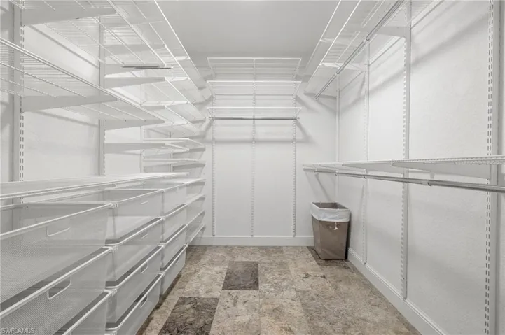 Stay organized with walk in custom closet in your master bedroom