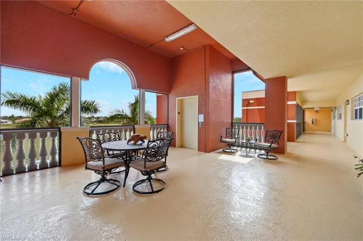 Semi private screened sitting area just off the elevator with the entry door located to the right of hall just steps away.