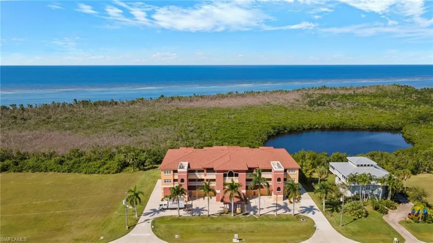 Villa Tuscany in Burnt Store Lakes offering a waterfront sunset view from the back porch and a lakefront sunrise view from the front porch area of the 3rd floor.