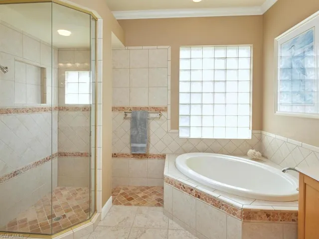 Primary bathroom...tub and entry to walk-in shower
