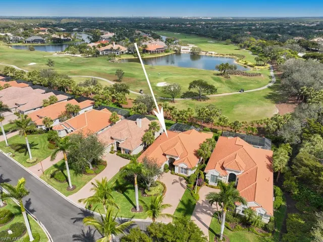 Drone image looking north from across the street at end of cul-de-sac. Back of house faces northeast. Ginger Pointe Ct. signature landscaping focus is the Royal Palms that line the roadway. Informal elegance.