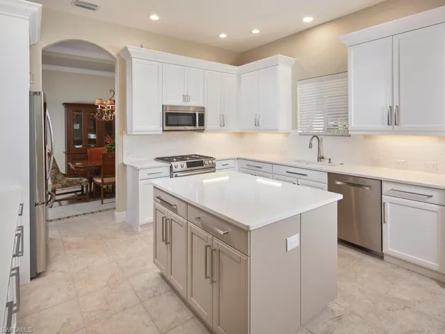 Kitchen leading to full dining room