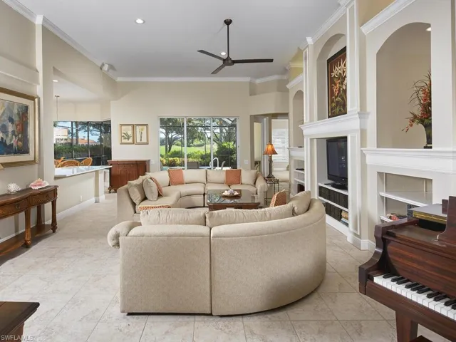 Great room architecture, neutral decorative color palette, new LED ceiling lighting and fan. Wow view of lanai and golf vista beyond!