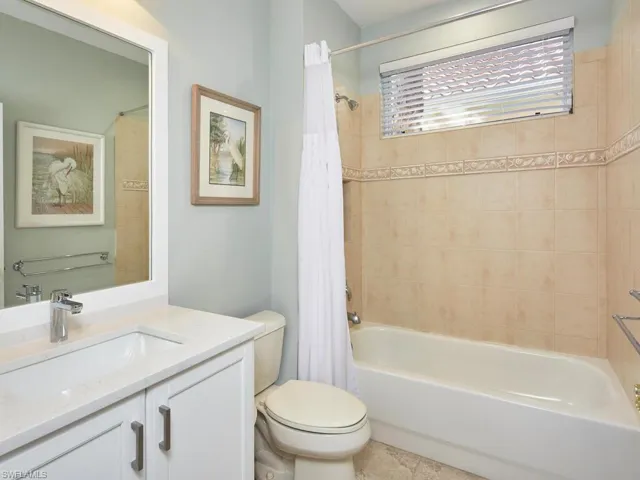 Guest bathroom just renovated with new cabinetry, quartz countertop, sink and plumbing.