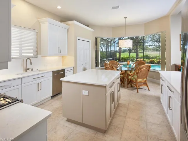 Center island kitchen with plenty of storage space and double door pantry. This is a natural gas house, kitchen cooktop is gas, not electric. All lower cabinets freshly painted, new pull handle hardware.