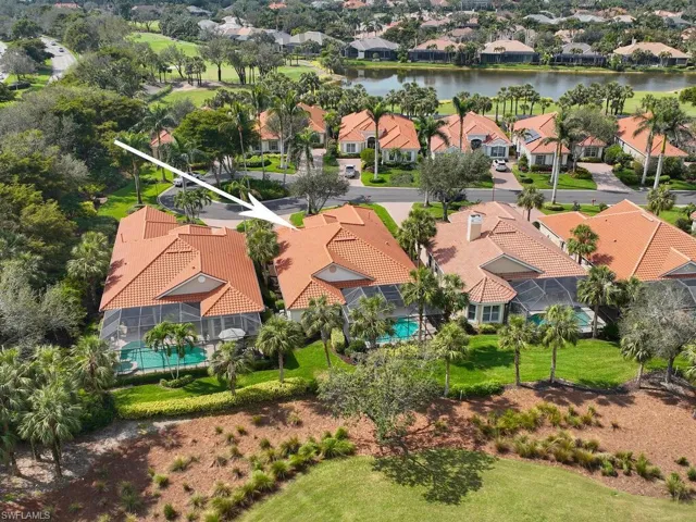 Looking at rear of house (toward south) from golf course. Very well landscaped and maintained by HOA contracted landscaper.