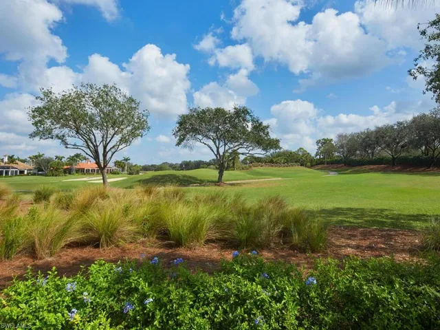 Outside lanai looking toward #6 green and path leading to long #7 par 5 fairway. Serene and private!