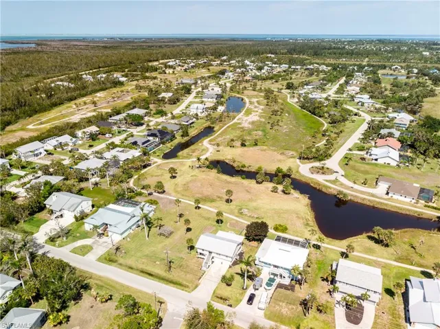 Aerial view featuring a residential view and a water view