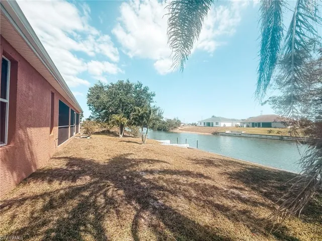 View of yard with a water view