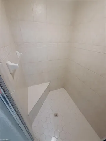 Bathroom with a tile shower